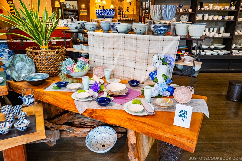 dinnerware on display inside porcelain shops at Arita Sera