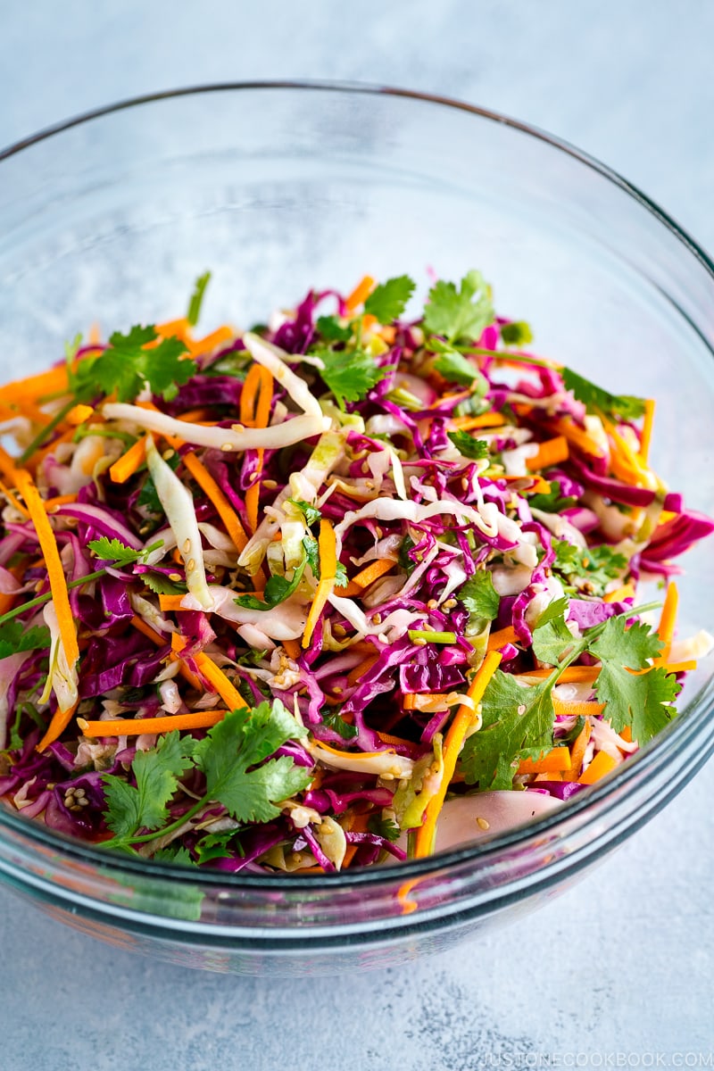 Asian coleslaw in a glass bowl.