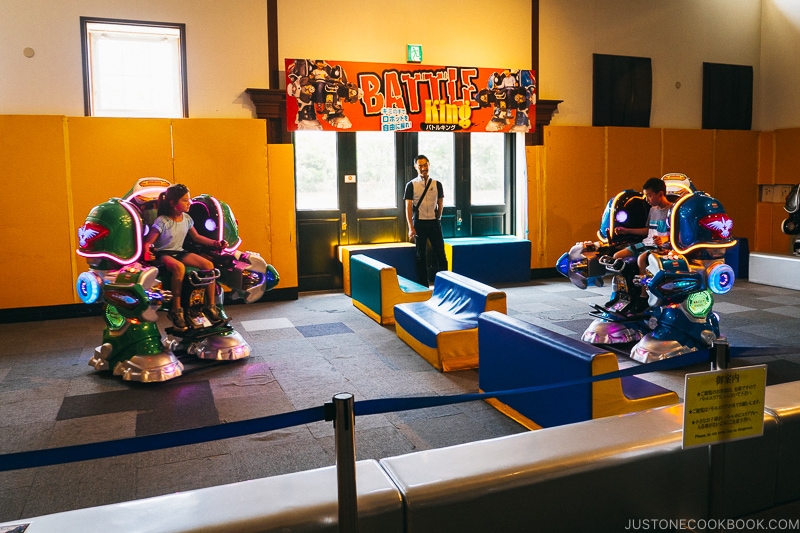 two children riding in robots battling each other