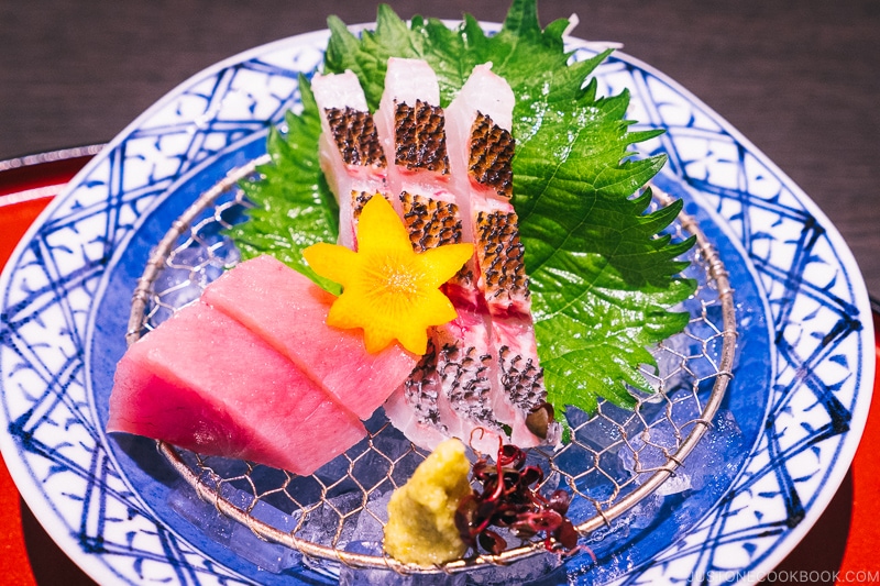 assorted sashimi on a blue and white plate