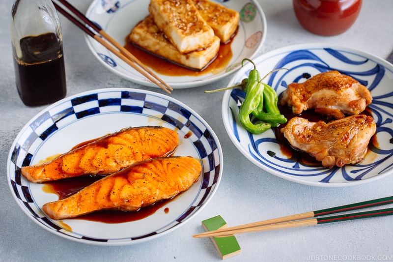 Three dishes with Teriyaki Salmon, Teriyaki Chicken, Teriyaki Tofu.
