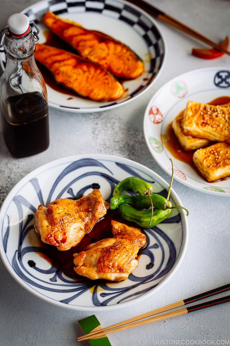 Three dishes with Teriyaki Salmon, Teriyaki Chicken, Teriyaki Tofu.