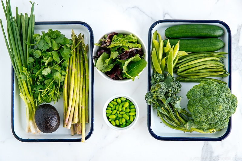 Trays of green vegetables.