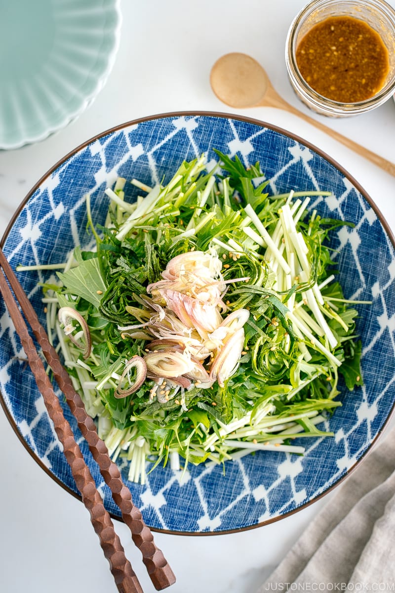 A blue Japanese bowl containing Mizuna Myoga Salad.