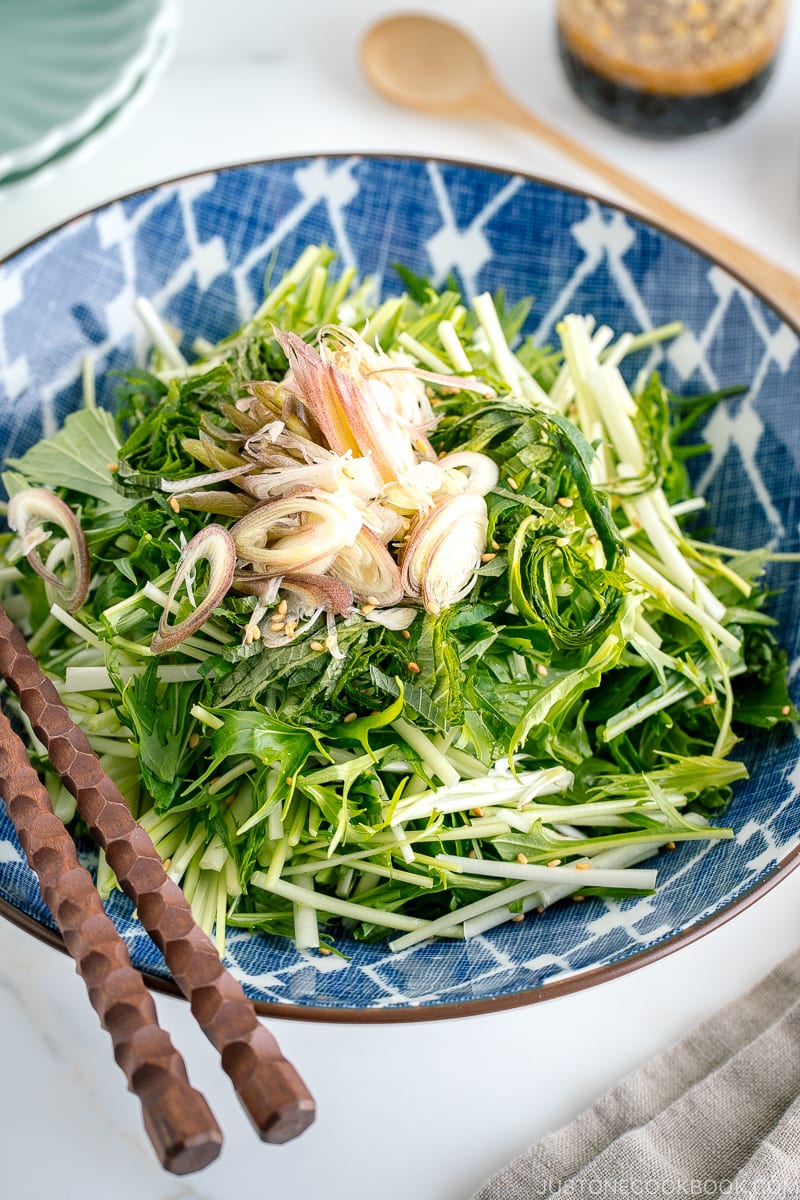 A blue Japanese bowl containing Mizuna Myoga Salad.