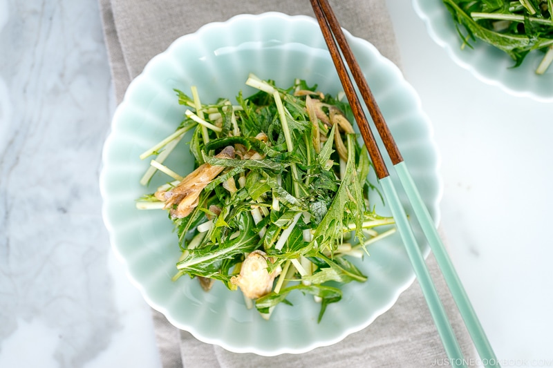 Light green plates containing Mizuna Myoga Salad.