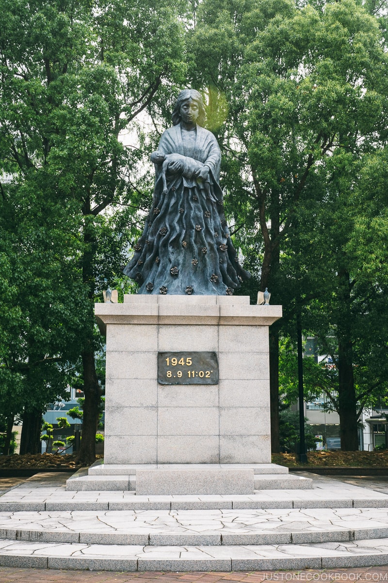 dark statue of mother holding dead baby