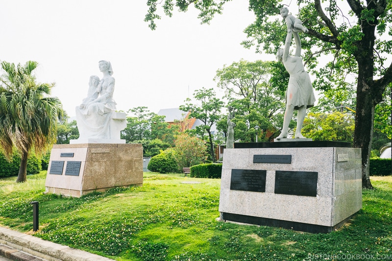 monuments and statues symbolizing peace on pedestal and grass