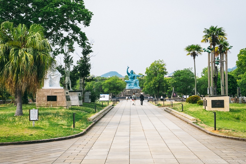 walkway with peace statue at the end