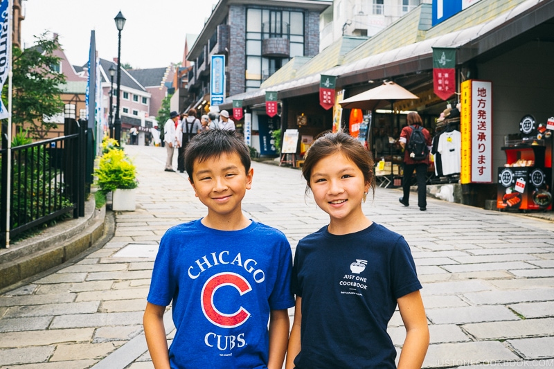 two children on paved stone path