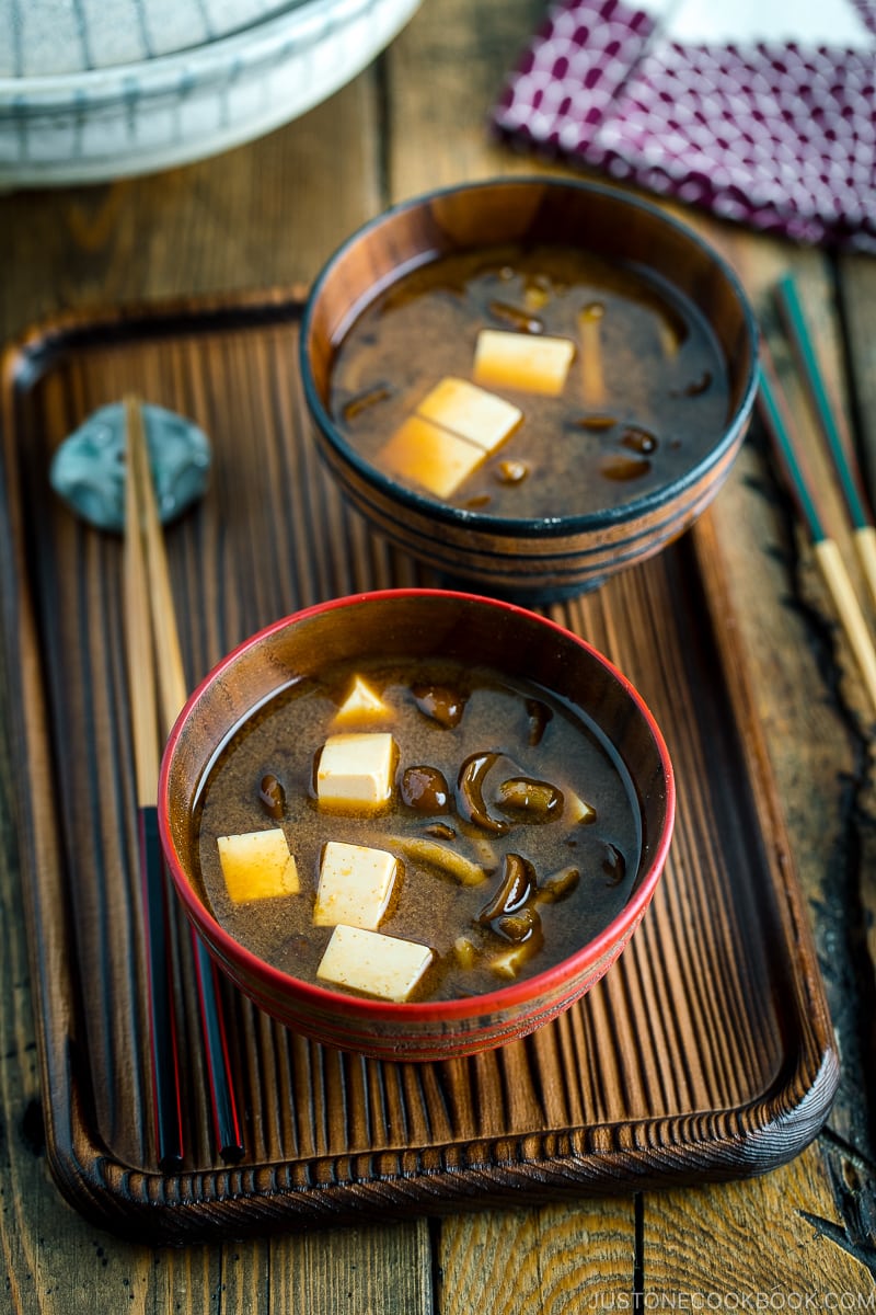 Japanese wooden bowls containing Nameko Mushroom Miso Soup.