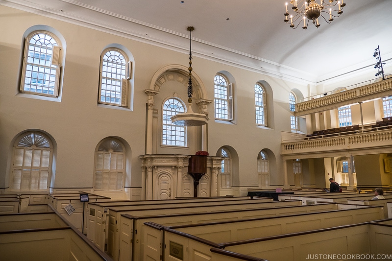 the hall at Old South Meeting House with seating area and a raise platform in the center