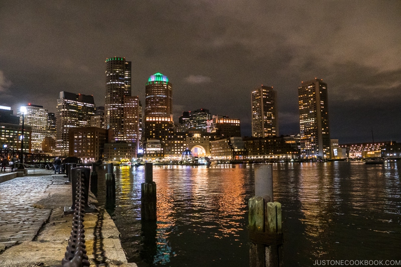 view of buildings in downtown Boston from Fan Pier Park at night