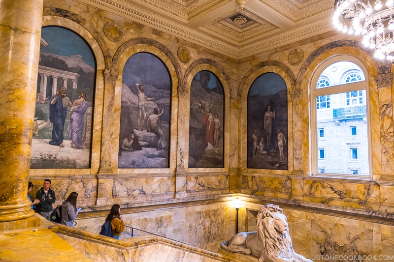 marble walls and paintings inside Boston Public Library