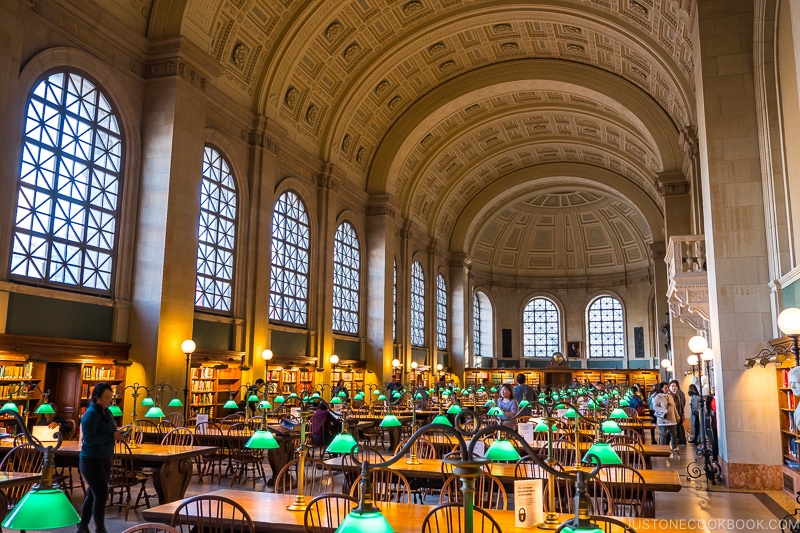 large hall with desks inside Boston Public Library