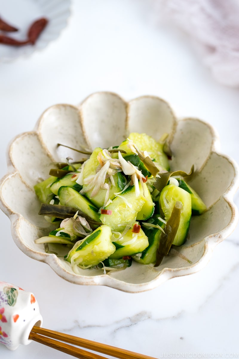 A flower shaped ceramic containing Pickled Cucumbers and Myoga.