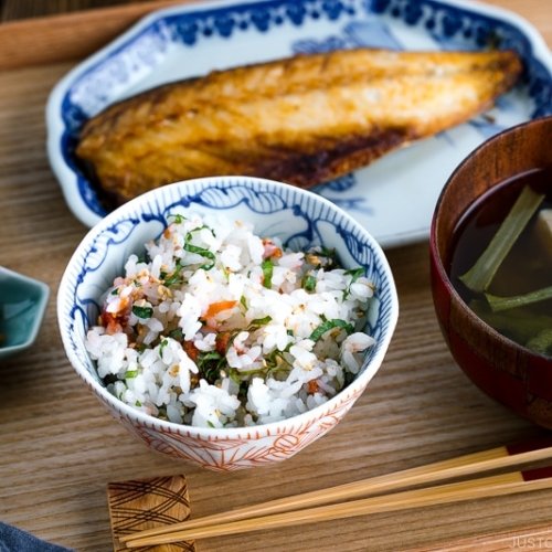 A rice bowl containing Ume and Shiso Rice served with mackerel and miso soup.