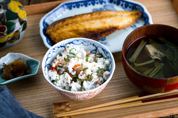 A rice bowl containing Ume and Shiso Rice served with mackerel and miso soup.