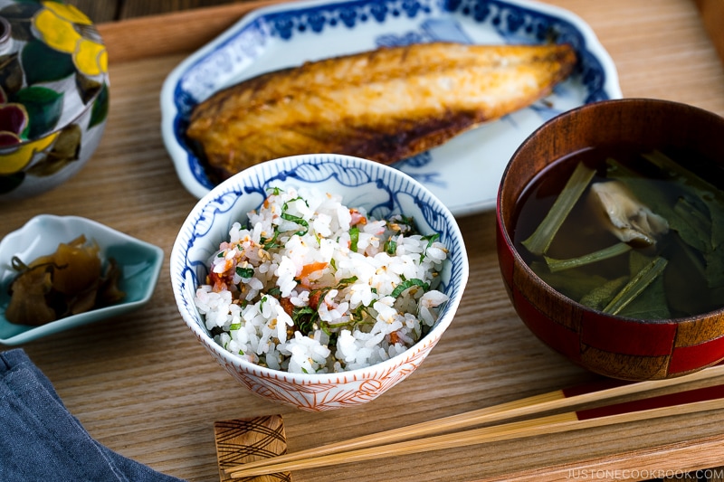 A rice bowl containing Ume and Shiso Rice served with mackerel and miso soup.