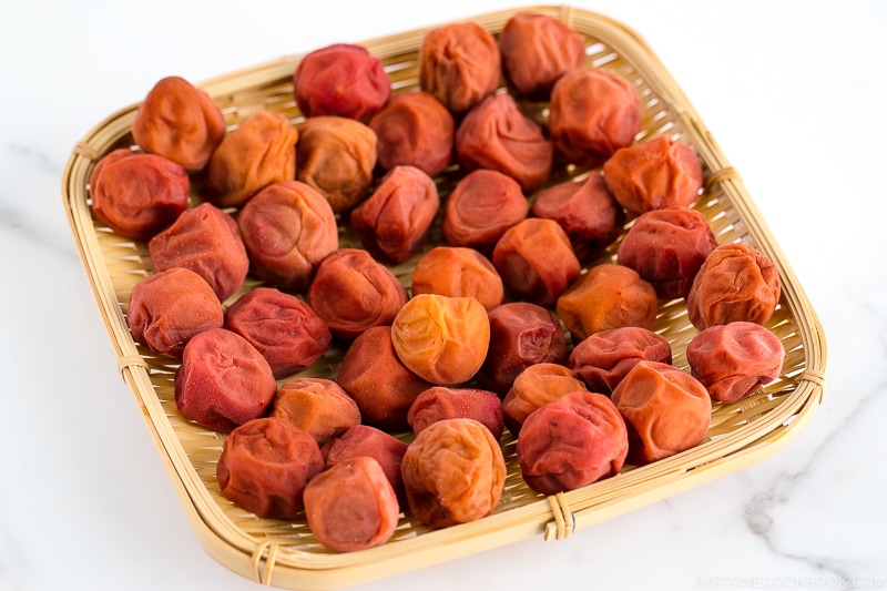 Umeboshi on a square bamboo basket.