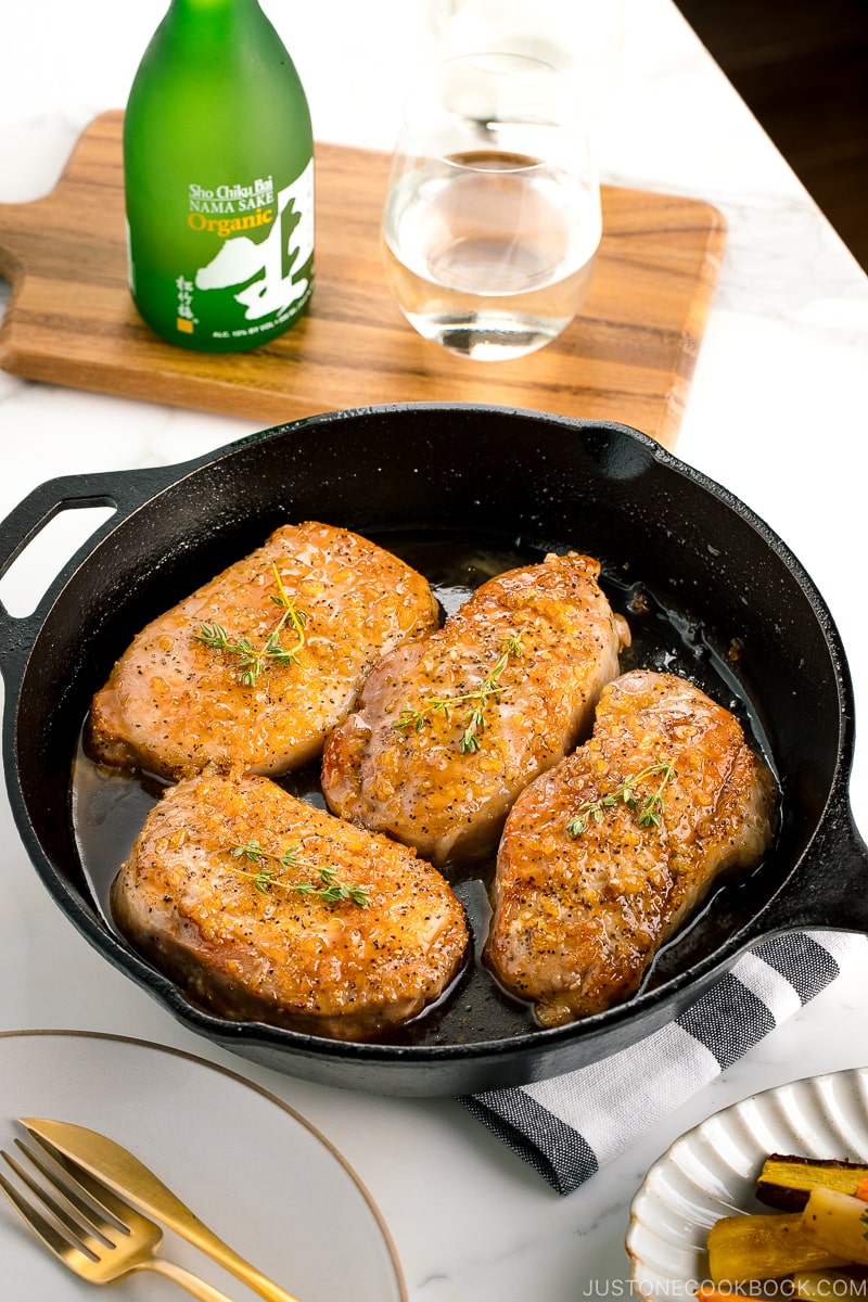 Juicy honey garlic pork chops in the cast iron skillet.