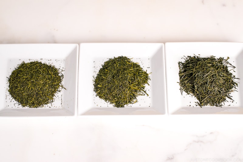 green tea leaves on 3 white plates