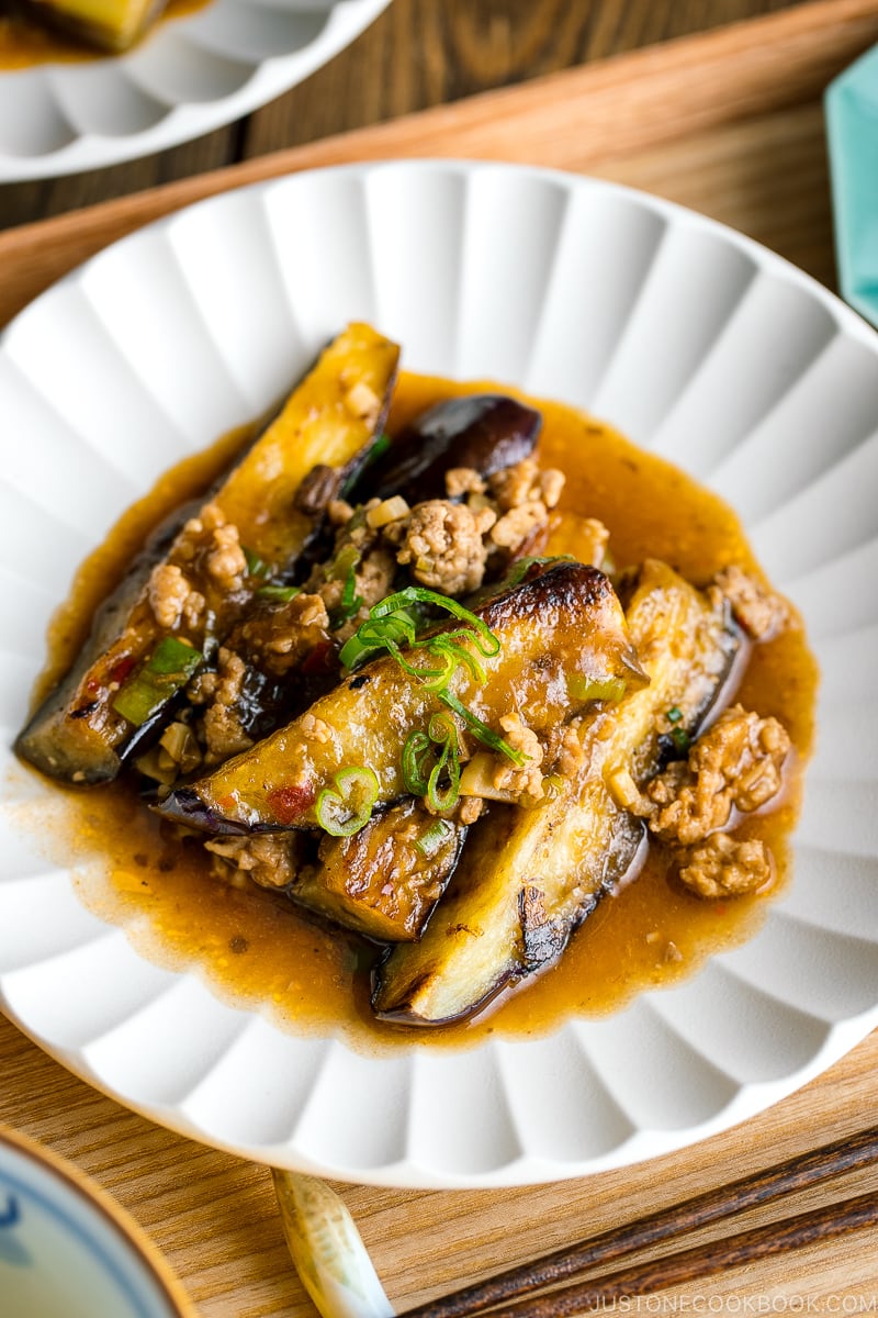 A white plate containing Mapo Eggplant (Mabo Nasu).