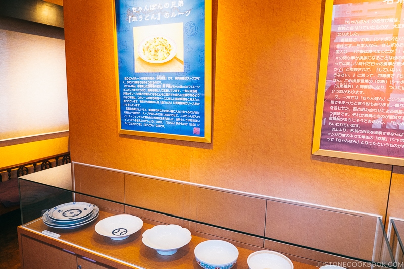 serving dishes in a glass display case