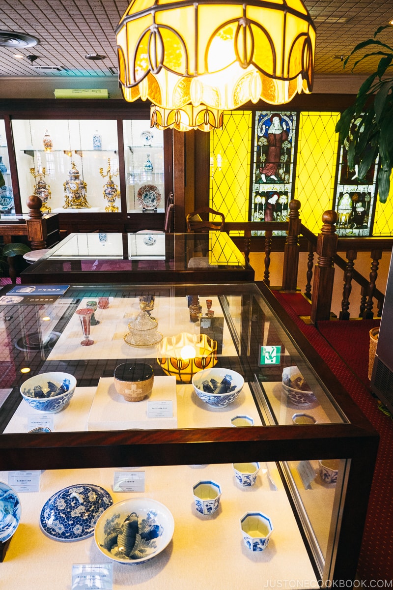 European and Japanese porcelain in a glass display shelf