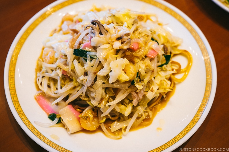 sara udon with soft noodles on a white plate