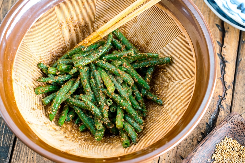 Green bean gomaae in a Japanese ceramic mortar.