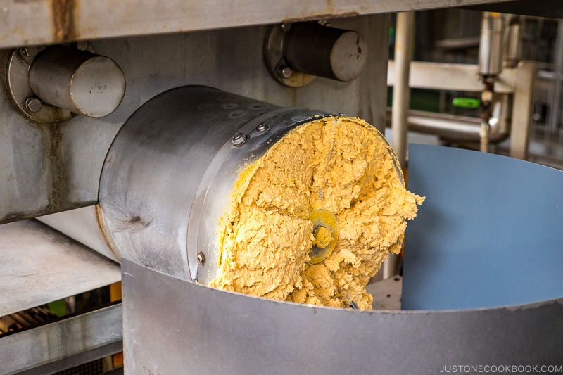 soy bean being extruded from machine