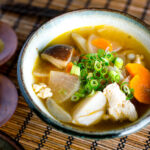 Handmade ceramic bowls containing Kenchinjiru (Japanese Vegetable Soup)