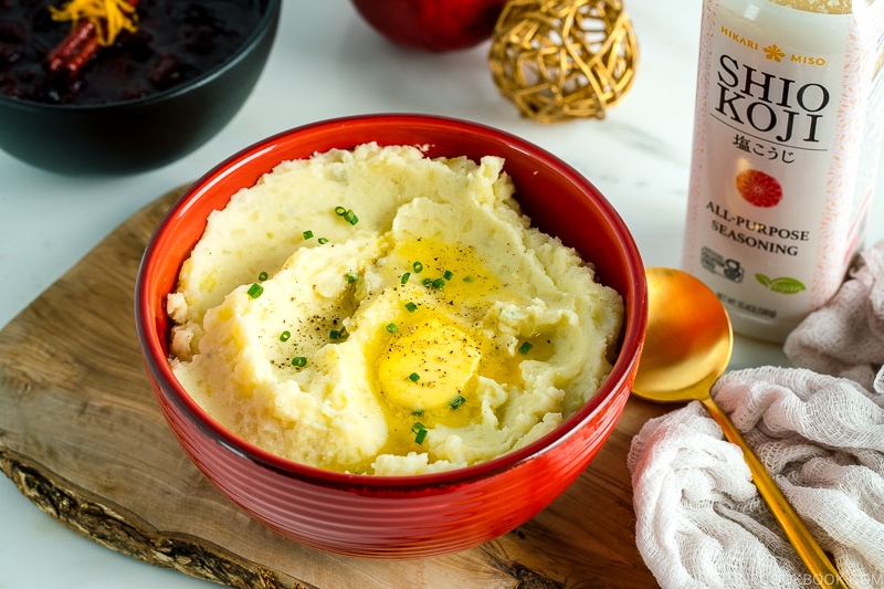 A red bowl containing Creamy Mashed Potatoes with Shio Koji.