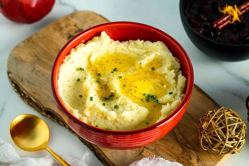 A red bowl containing Creamy Mashed Potatoes with Shio Koji.