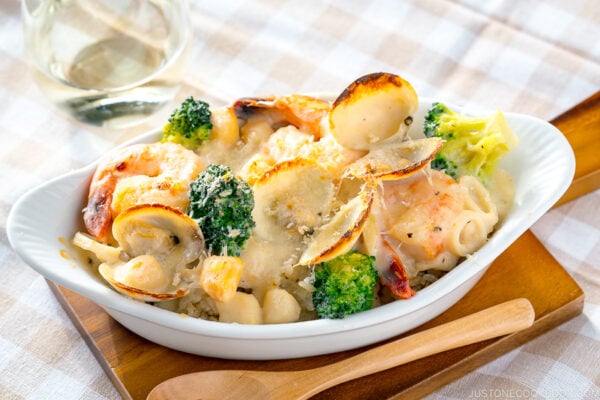 A white gratin dish containing Seafood Doria (Rice Gratin).