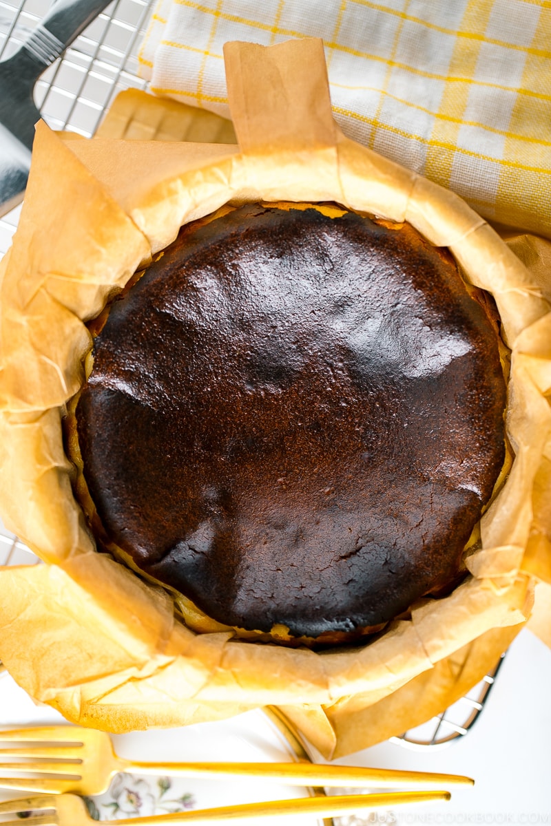 A cake pan holding Basque Burnt Cheesecake.