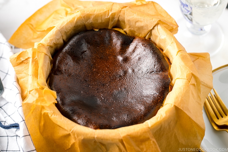 A cake pan holding Basque Burnt Cheesecake.