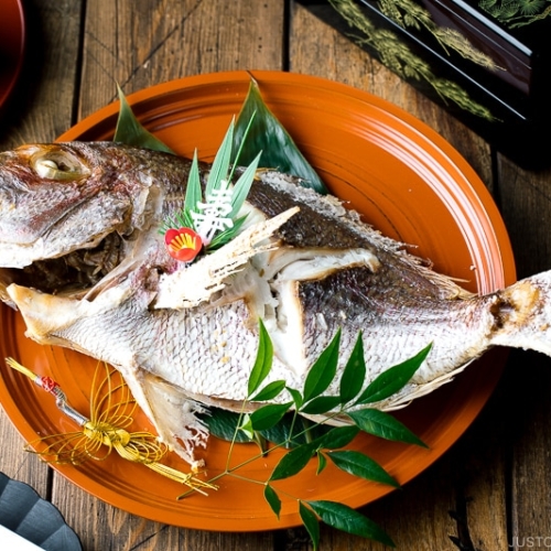 A lacquer tray containing a whole Japanese Baked Sea Bream.