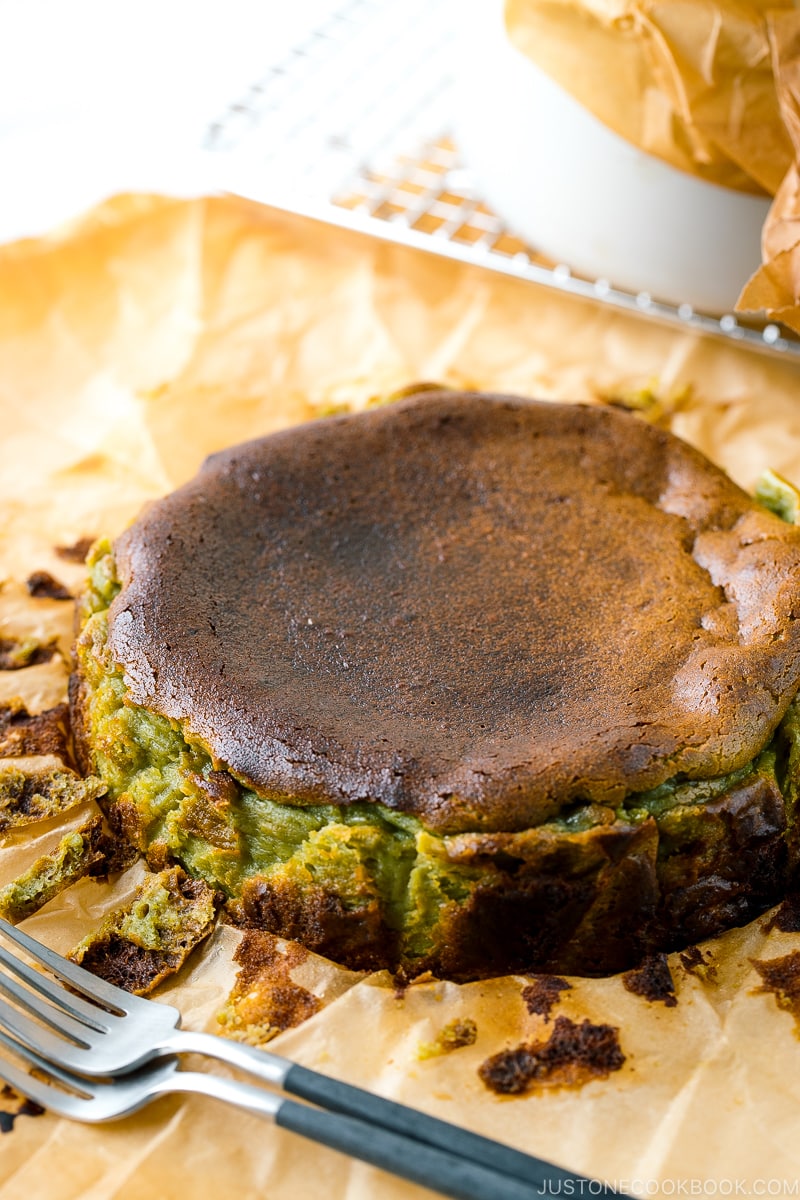 A Matcha Basque Burnt Cheesecake on top of the parchment paper.