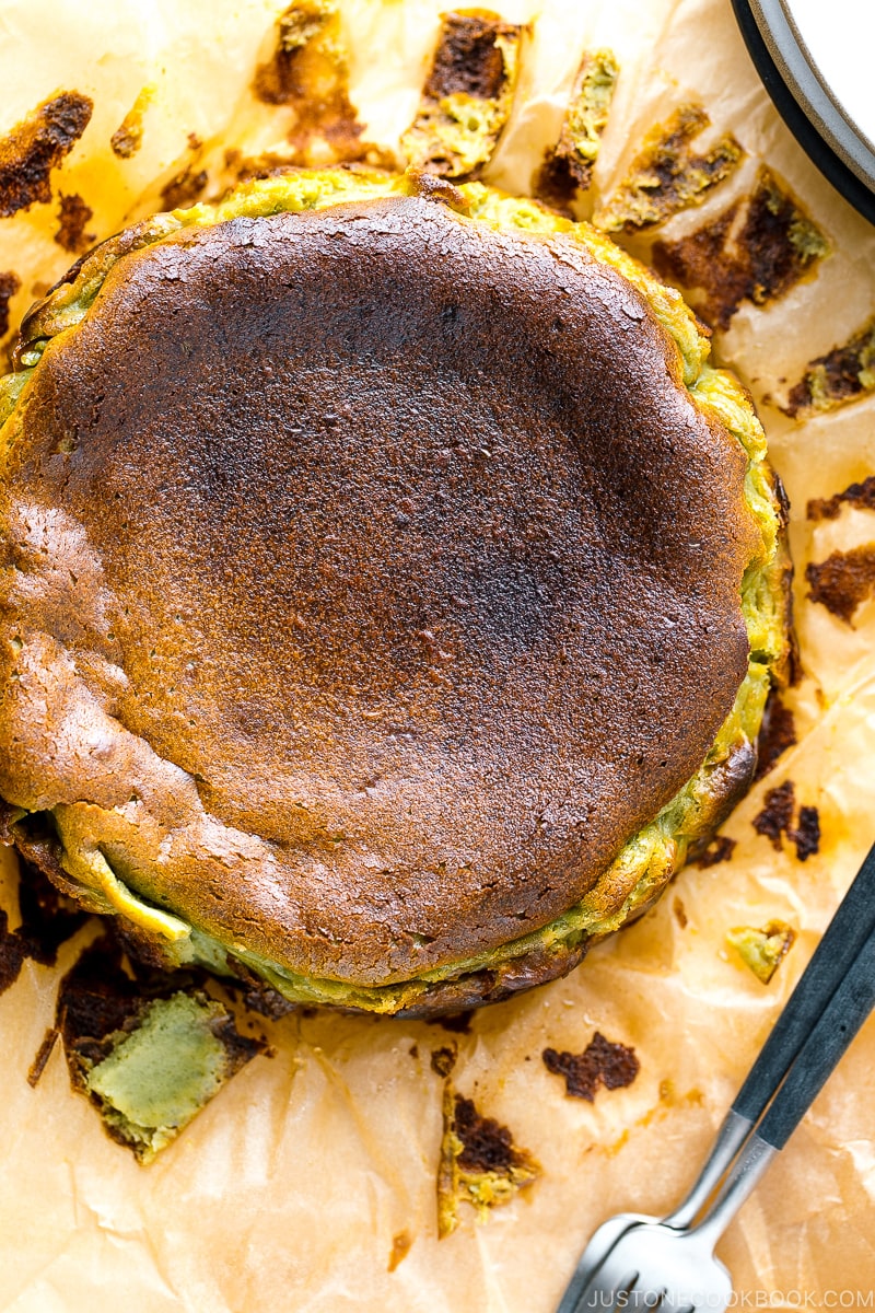 A Matcha Basque Burnt Cheesecake on top of the parchment paper.