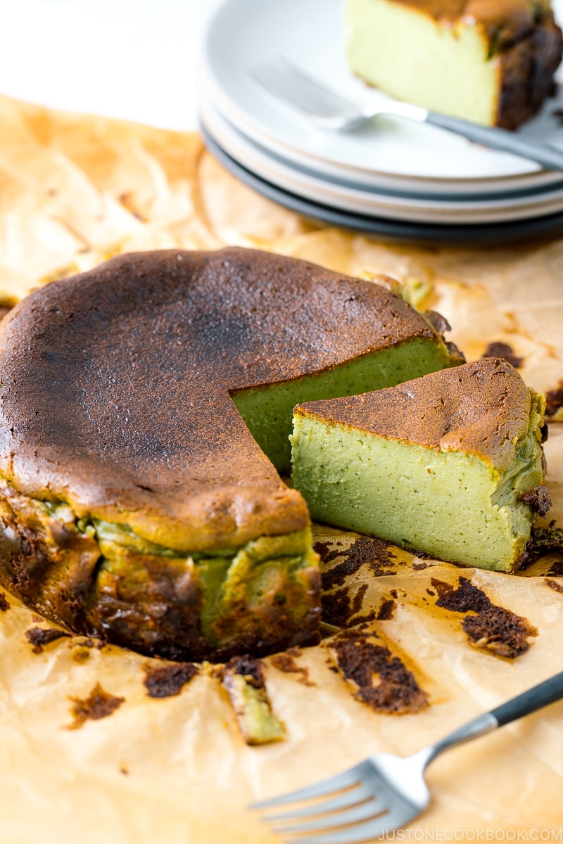 A Matcha Basque Burnt Cheesecake on top of the parchment paper.