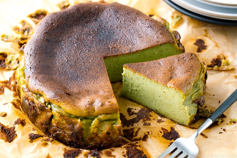 A Matcha Basque Burnt Cheesecake on top of the parchment paper.