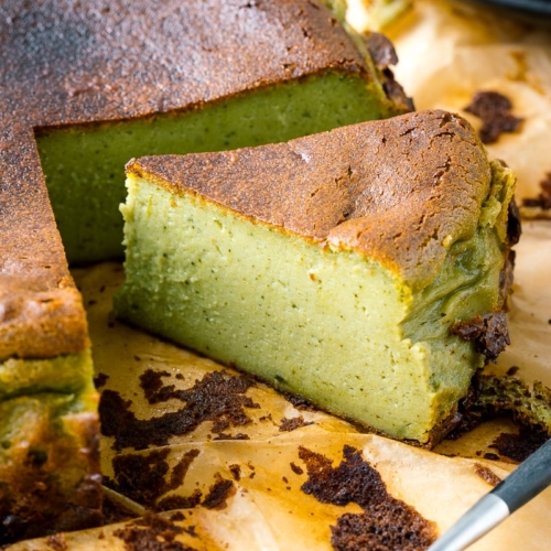 A Matcha Basque Burnt Cheesecake on top of the parchment paper.
