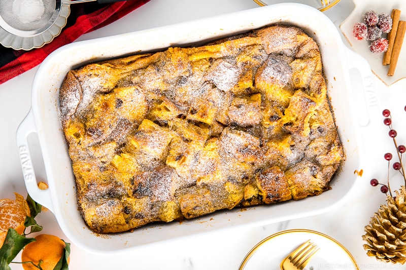 A white casserole dish containing Panettone Bread Pudding.