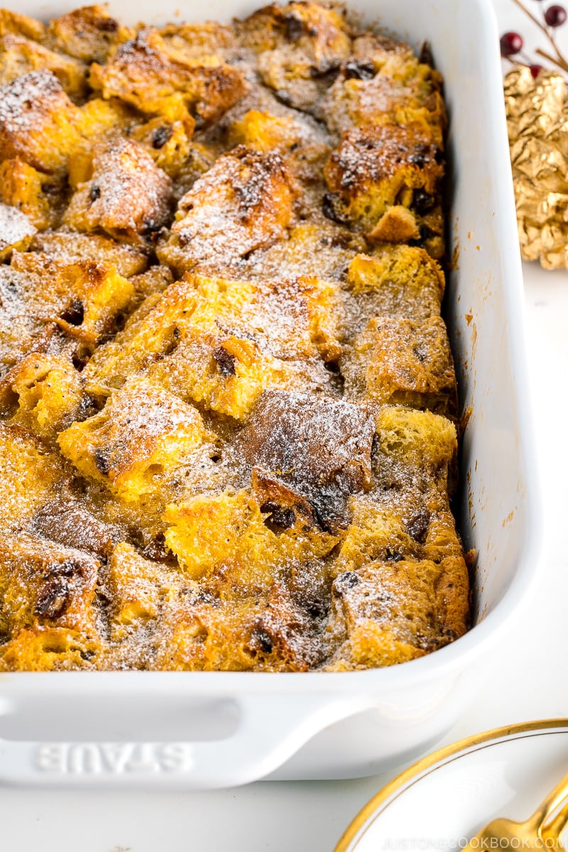 A white casserole dish containing Panettone Bread Pudding.