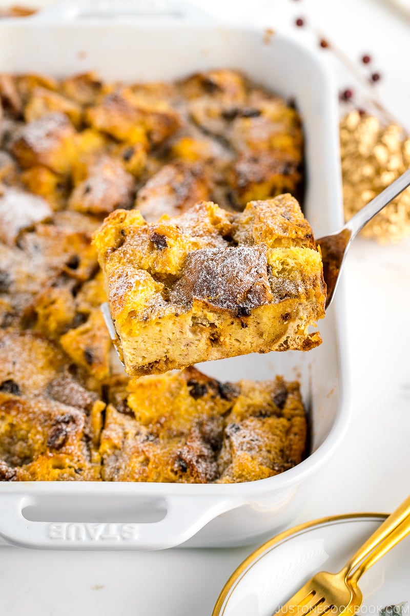 A white casserole dish containing Panettone Bread Pudding.