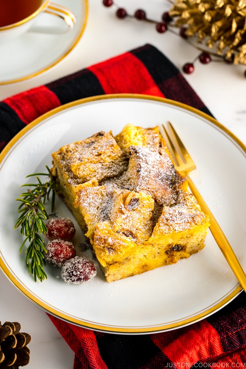 A plate containing a slice of Panettone Bread Pudding.