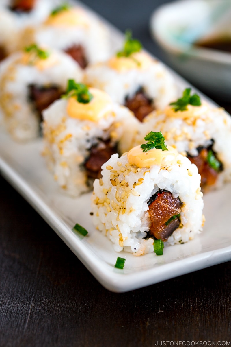 spicy tuna rolls tossed in sesame Sriracha sauce, topped with spicy mayo