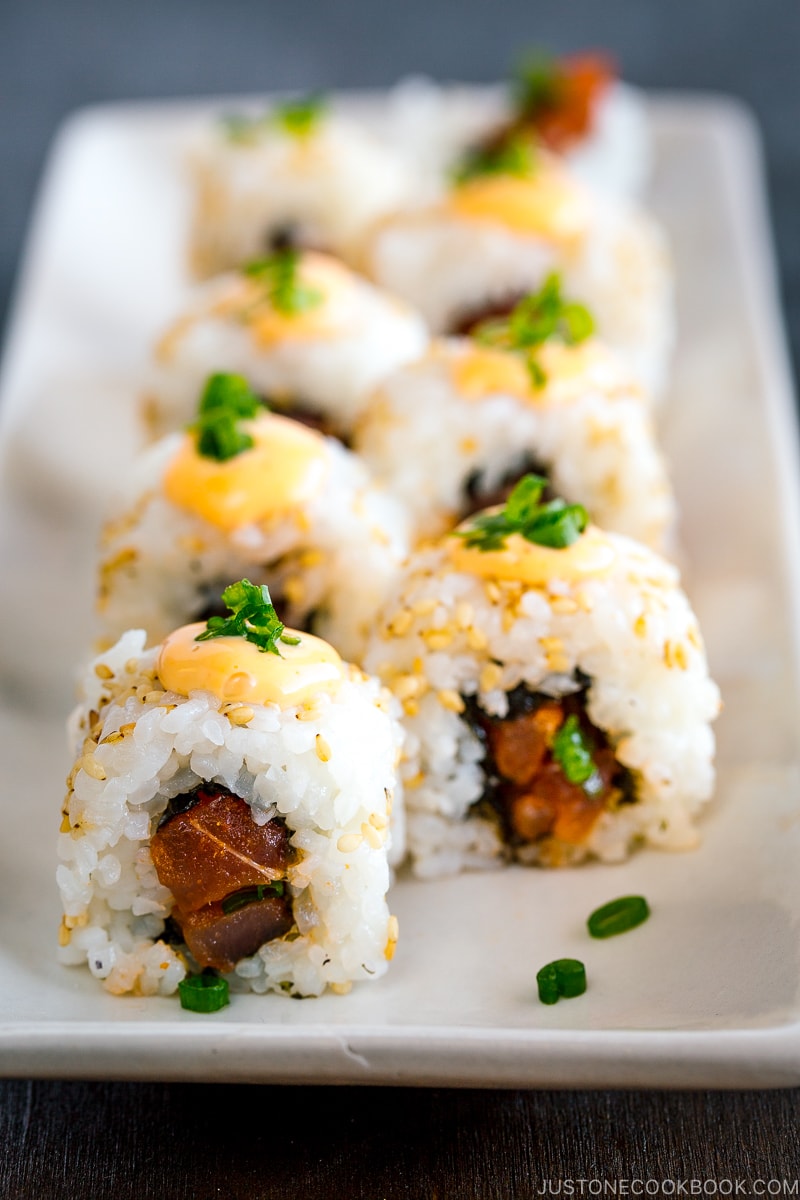 spicy tuna rolls served on a white plate